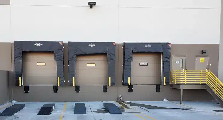 Loading dock equipment with dock levelers and seals