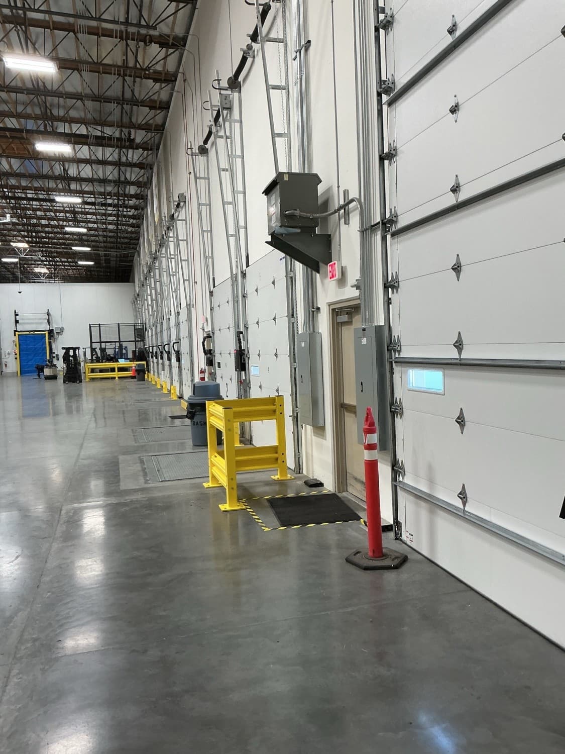 Warehouse loading dock doors and dock equipment